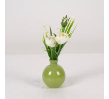 Ranunculus in green glass vase H22cm white