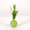Ranunculus in green glass vase H22cm pink