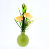 Ranunculus in green glass vase H22cm yellow